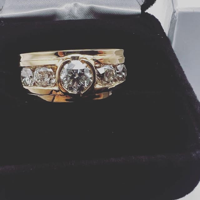 The finished ring in its presentation box, ready to hand back across the counter.
